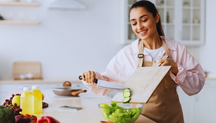 girl cooking happily